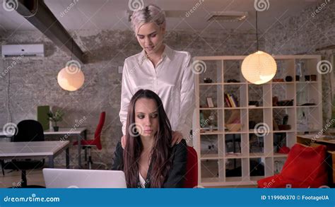 girl on girl videos|Young blonde lesbian massaging woman in modern office during。